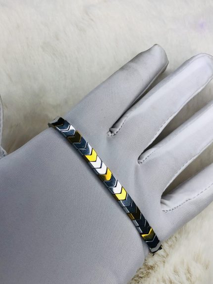 Simple chains in gold, silver, or stainless steel. Pendants like crosses, dog tags, or geometric shapes are also common.