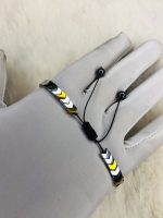 Simple chains in gold, silver, or stainless steel. Pendants like crosses, dog tags, or geometric shapes are also common. - Image 2